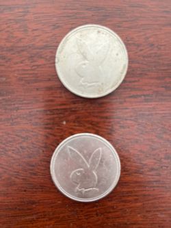 Two (2) $1 Playboy Hotel and Casino Coins. Also two (2) thimbles