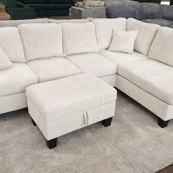 Brand new ivory color corduroy Sectional Sofa with storage ottoman and 2 accent pillows.
