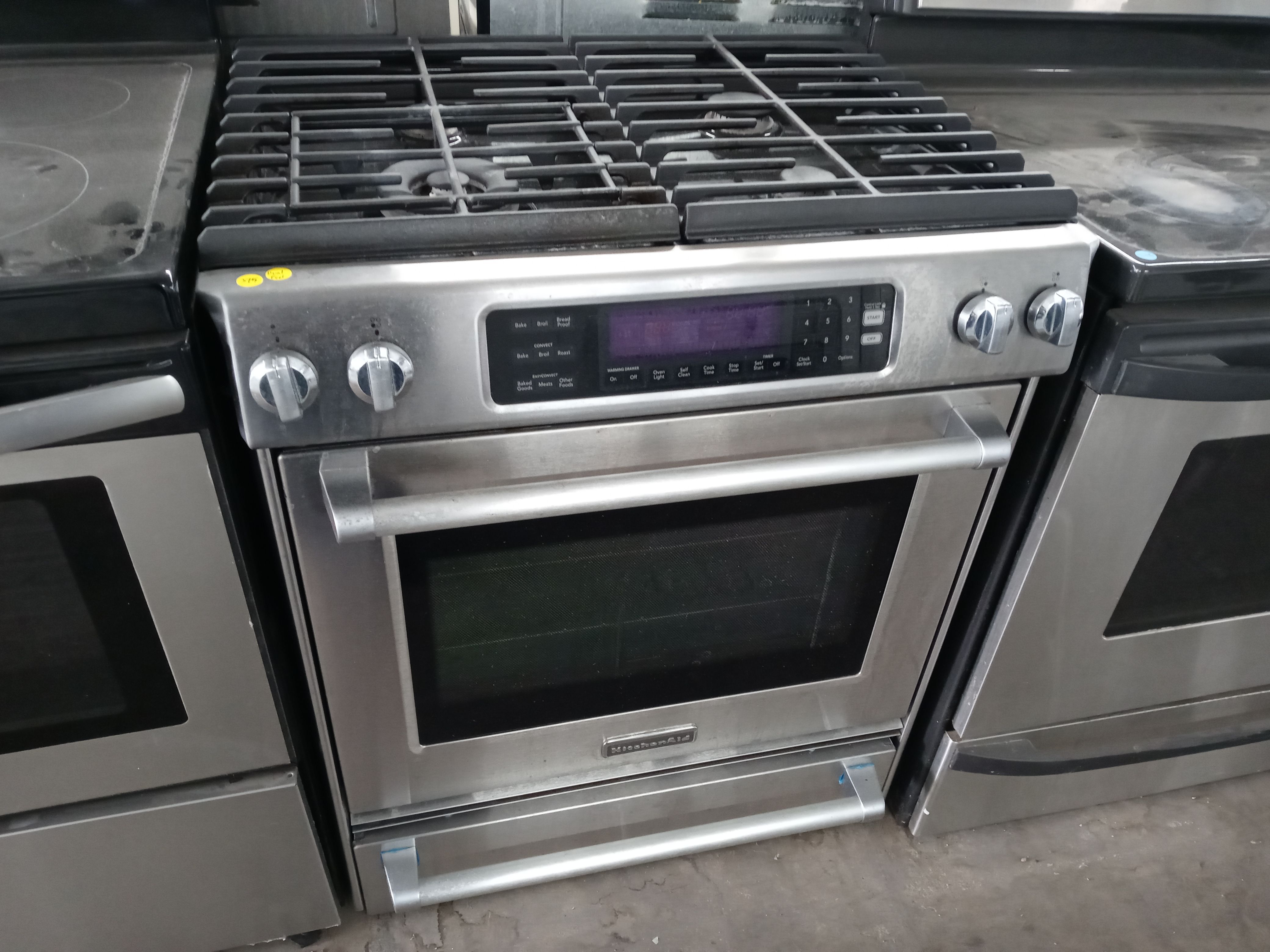 KitchenAid stainless steel 4-burner dual-fuel slide-in range - Free delivery