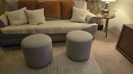 2 round gray ottomans