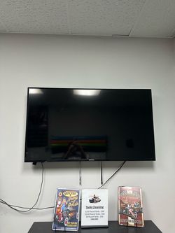 55” Flat screen tv includes mount and system