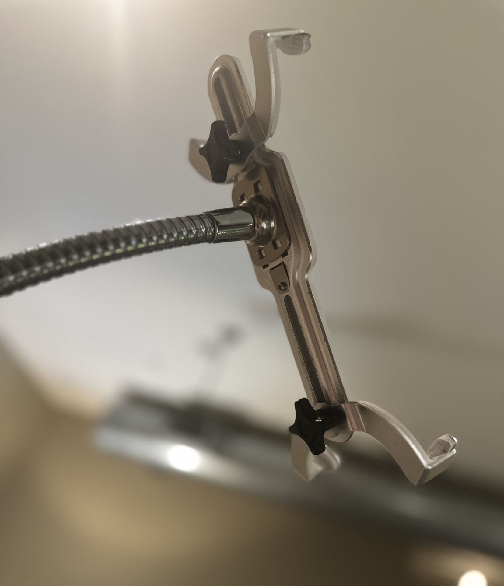 Flexible gooseneck tablet holder with sturdy base.