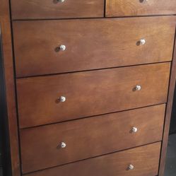 Beautiful Tall Ashley's Furniture  5 Draw Dresser, Solid Wood Excellent Condition, Draws On Rollers. .