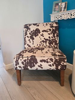Chair/large 2 seater cowhide chair.