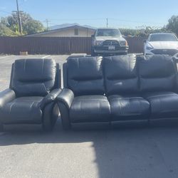 black leather reclining sofa and matching armchair set