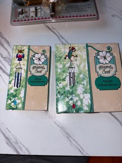 Magnolia Creek brand metal windchimes, featuring colorful decorative tops