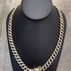  18 karat Gold plated Hip Hop 12.5 mm Cuban link 20” brass prong set Cubic Zircon simulated stone with solid weight being two toned with a secu