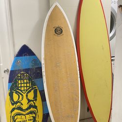 Two Surf Boards And Two Skim Boards 