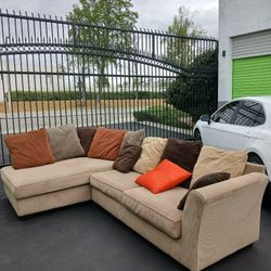 Corner Couch, Rug, Painting. 