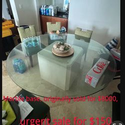 The large glass brick dining table is very beautiful. The original price was $8,000. It is like new. $150