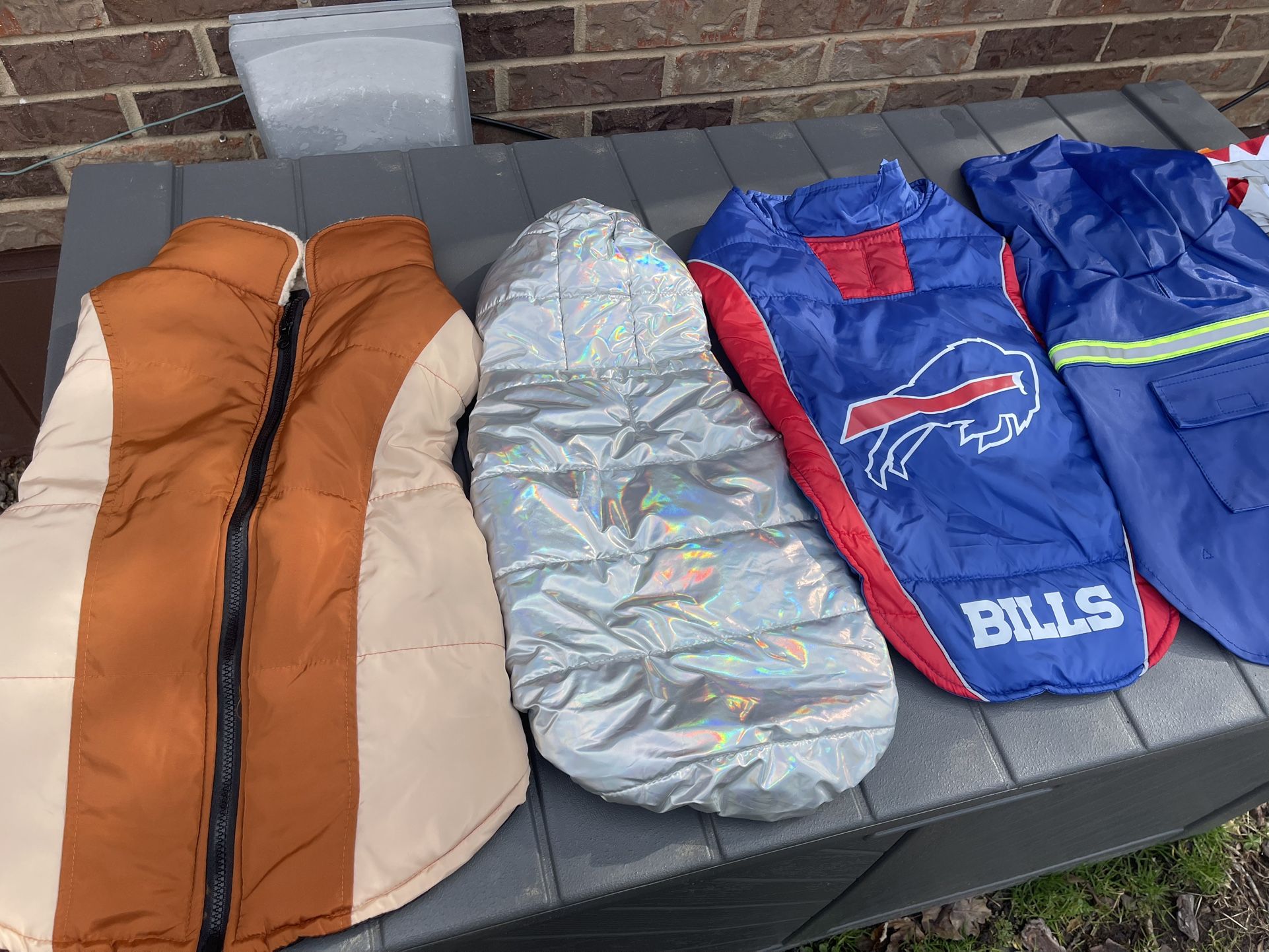 Large assorted dog coats, and raincoats $15 each