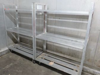 Commercial Aluminum freezer/cooler shelves and Carts shelving without wheels start at $50 with 2 sheves and the ones with wheels start at $150-$200 ea