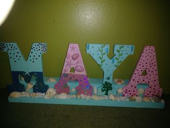Wood letters personalized different sizes that depend the prize. (bet. $10 .00 - $20.00 )