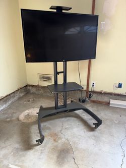 LG TV 32” with Kanto Mobile TV Stand