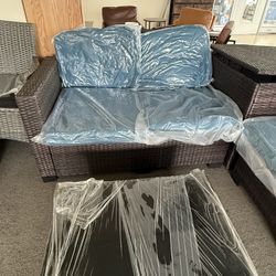 Outdoor Patio 4 pieces set with a large storage box. Tempered glass table top, brand new set with unopened cushions  $550