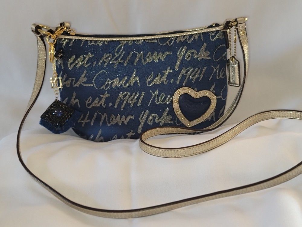 Coach Poppy Signature Script Blue Gold Wristlet