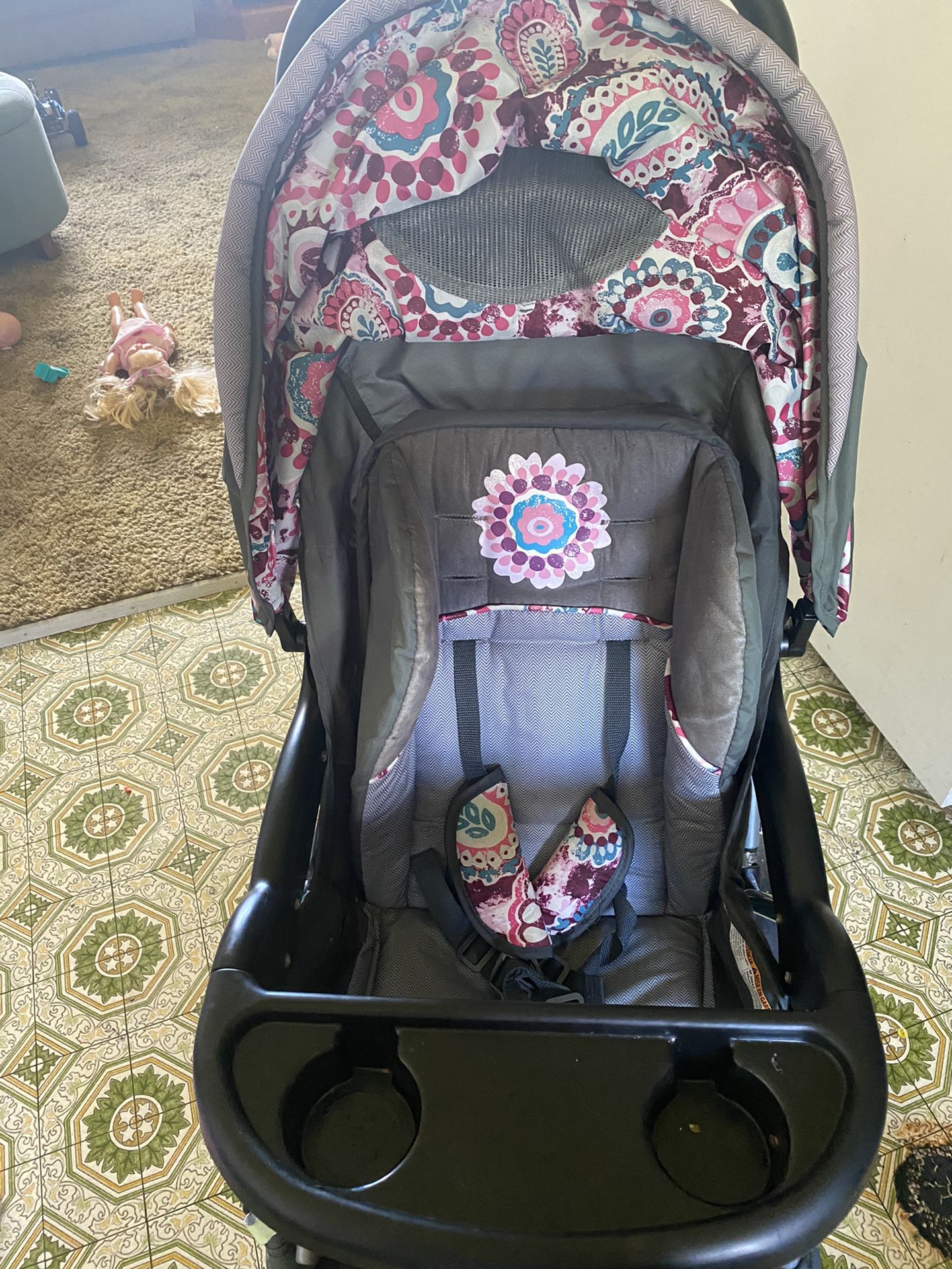 Stroller with car seat and base.