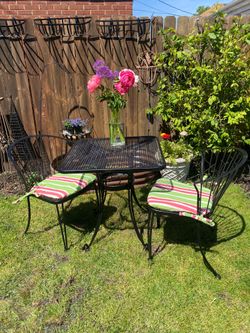 4 piece set of black wrought iron outdoor patio bistro set 2 chairs, table & new outdoor cushions