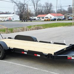 'Heavy-duty TRAIL KING 7x18 I-Beam Equipment Trailer is built for strength and reliability with an 8" I-beam frame.