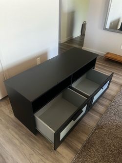 Solid Black Entertainment Center with glass accent windows on the drawers!