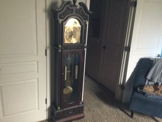 GRANDFATHER CLOCK MAROON IN COLOR….72X18X9 BATTERY OPERATED IN EXCELLENT CONDITION..RETAILS NEW AT 299.95 PUS TAX