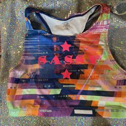 Girls tie-dye sports bra with “sassy” in hot pink