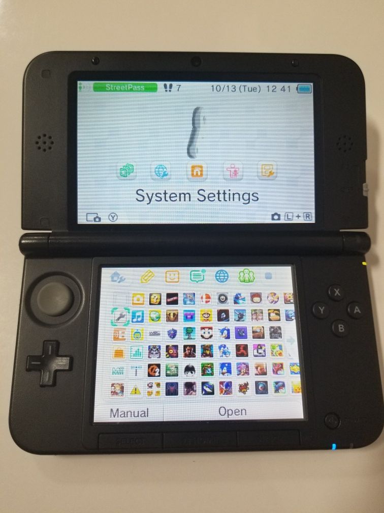 NINTENDO 3DS XL W/ CHARGER AND 125 GAMES (NO STYLUS)