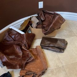 Leather Hides And Pieces. 2 Boxes Full