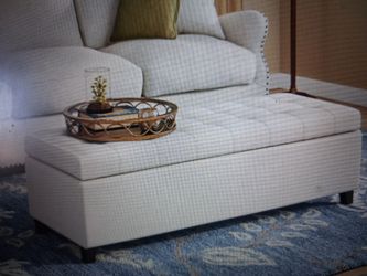 Cream color Upholstered Ottoman.