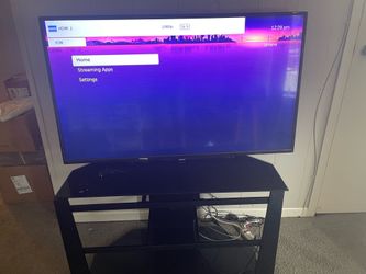 approximately 55-inch Toshiba TV with stand & Roku