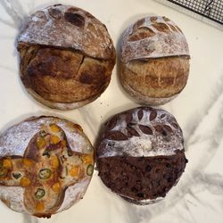 Fresh homemade sourdough and cinnamon rolls made with simple ingredients and baked daily
