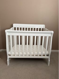 Dream on Me 4 in 1 Mini crib in white. Perfect for small spaces.