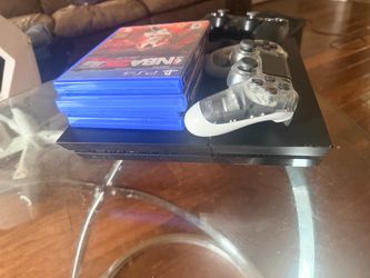 PlayStation 4 Console with Controllers and Games
