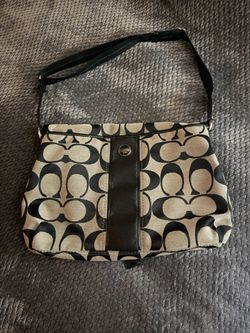 Black/Tan fold over Coach purse. Excellent condition