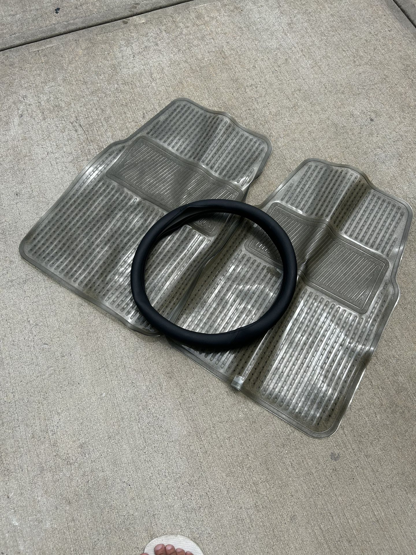 plastic car mats and steering wheel cover never used