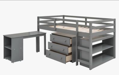 Twin low loft bed with a roll-out desk and storage