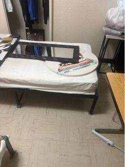 A twin bed with frame
