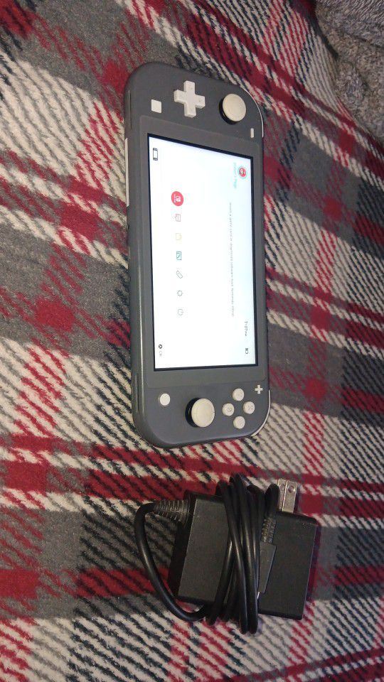 Nintendo switch, light in good condition.+it Comes With A Pair Of Wireless Headphones 