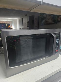 Toshiba 1.2-cu ft 1000-Watt Countertop Microwave with Humidity Sensor and Eco Mode  ,Stainless steel
