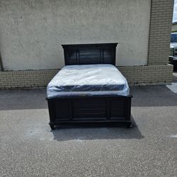 Black full-size solid wood bed frame  with brand full-size plush mattress and box spring in plastics 