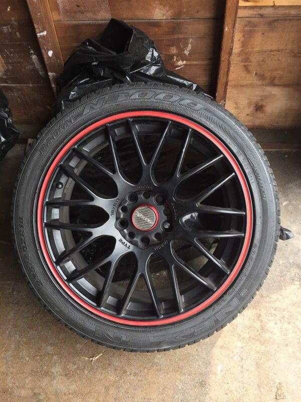 Rines rojos/negro marca #Tenzor (5)Lugs Universal 235/40ZR18 93Y. $650
