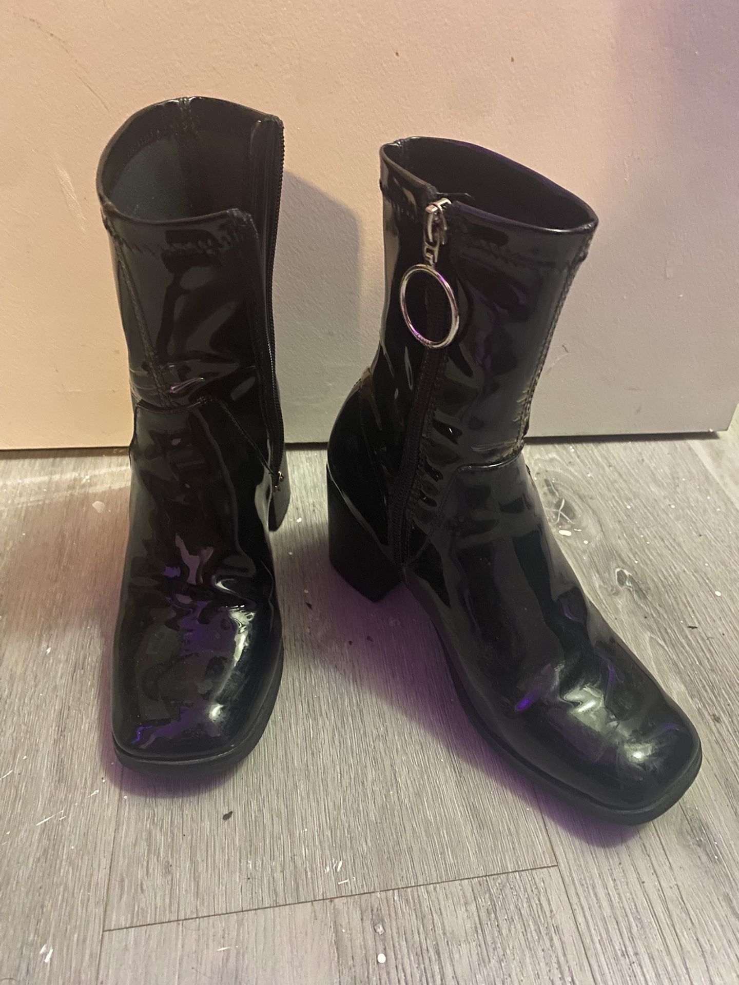 Black patent leather heeled boots with silver hoop accent (SIZE 6 US)