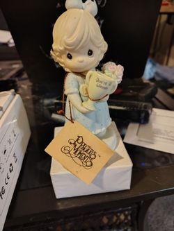 This is a vintage Precious Moments porcelain figurine titled "You're My Number One Friend"