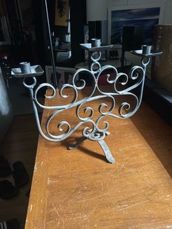 Wrought iron candle holder. 15.5"x19.5 good cond. as is pick up deliver.