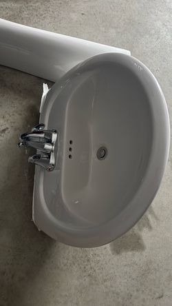 White Ceramic Bathroom Sink with Chrome Faucet