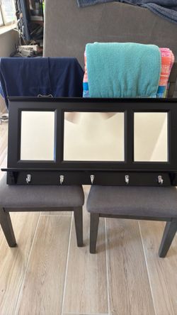 An entrance mirror or coat hanger.