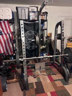 Power Rack with Barbell and Weight Plates