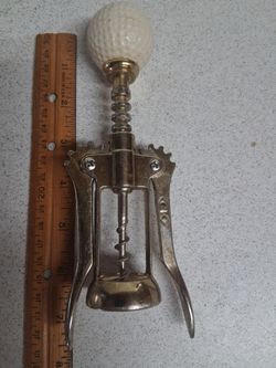 Corkscrew wine bottle opener topped with Golfball