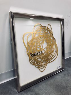 Rose gold framed metal art
