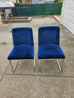 2 blue velvet chairs